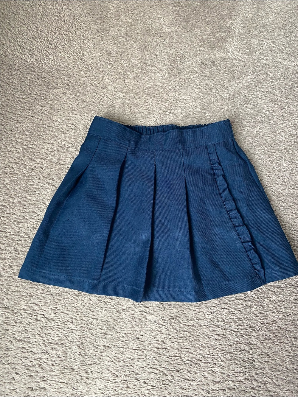 Girls Pleated Navy Skirt with Side Ruffle